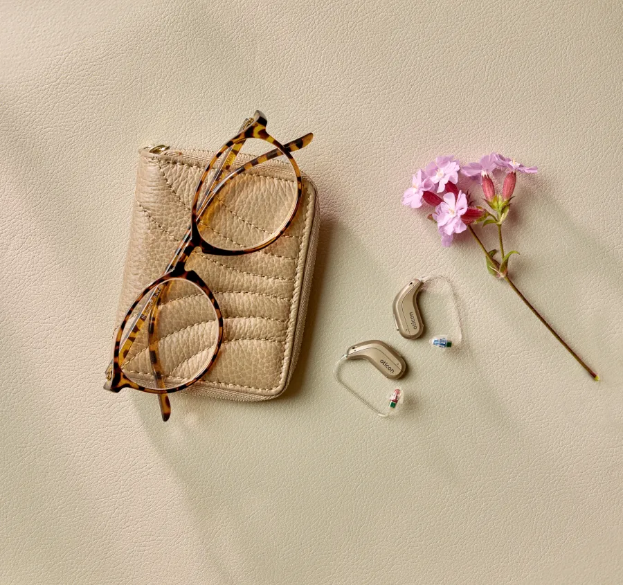 Oticon Intent miniRITE hearing aids resting in a wallet case